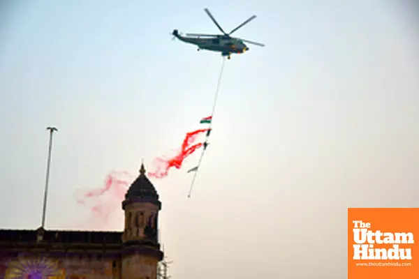 Mumbai: Indian Navy personnel perform stunts during the Navy Day celebrations at Gateway of India