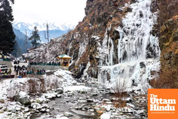 Baramulla: Tourists visit the frozen waterfall in the Drung area of Tangmarg