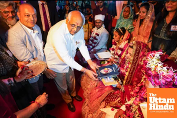 Surat: Gujarat Chief Minister Bhupendra Patel and diamond trader Mahesh Savani bless a couple during a mass wedding ceremony