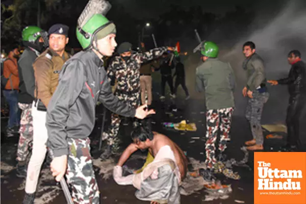 Patna: Police personnel baton-charge to disperse aspirants during their protest against the BPSC