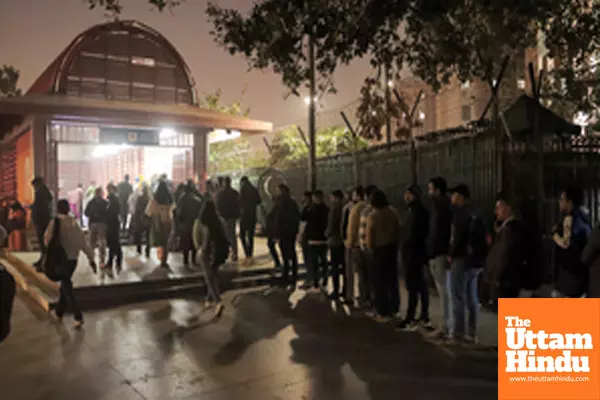 New Delhi: People stand in a queue outside Udyog Bhawan Metro Station