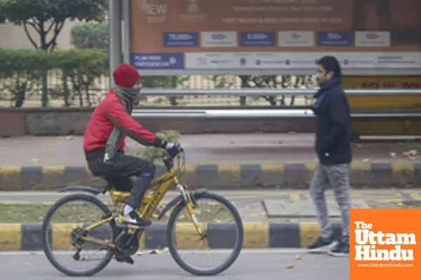 New Delhi: A man rides his bicycle along a foggy street in cold weather and reduced visibility