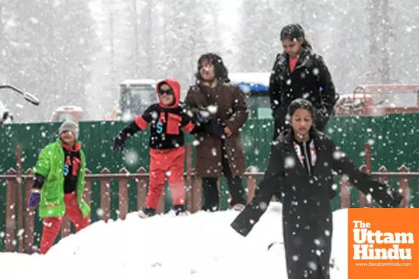 Baramulla: Children enjoy playing in the snow during heavy snowfall