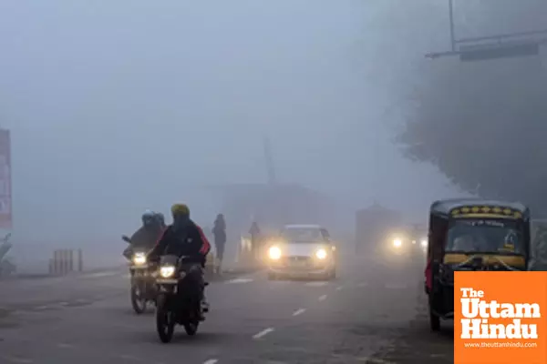 Amritsar: Commuters navigate a road amid dense fog during a cold winter morning