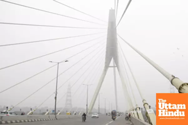 New Delhi: A thick layer of fog engulfs the Signature Bridge