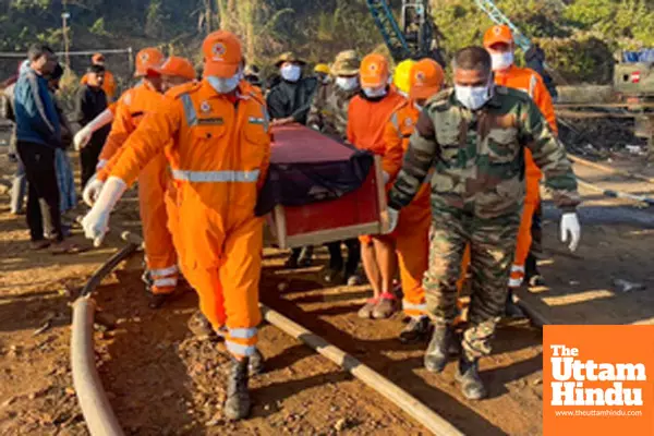 Dima Hasao: NDRF personnel carry the body after rescue teams recovered the second miner from the flooded coal mine