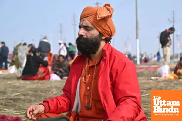 Prayagraj: A devotee meditates on the banks of Sangam