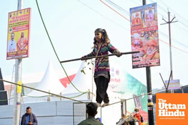 Prayagraj: A young girl performs a tightrope act at the banks of Sangam