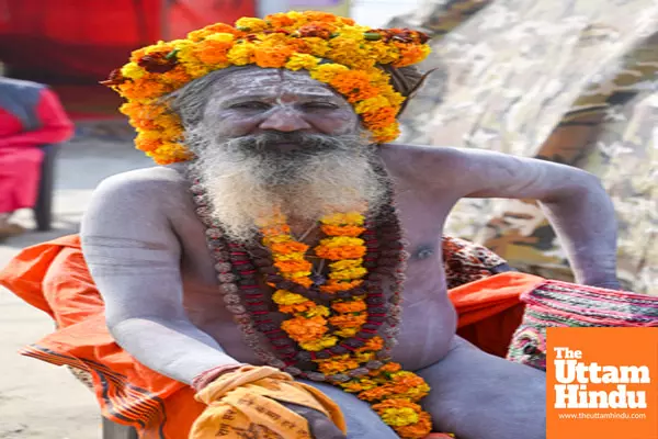 Prayagraj: A Sadhu poses for photos at his camp near the Sangam for the Maha Kumbh Mela 2025