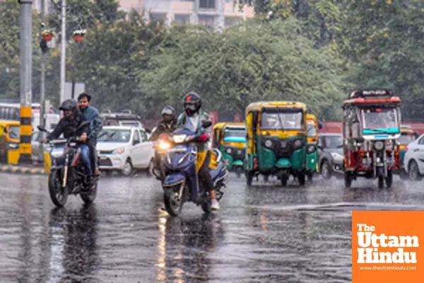 Jaipur: Vehicles pass through the streets amid rainfall