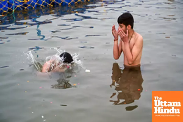 Prayagraj: Devotees take a holy dip in Sangam ahead of the Maha Kumbh Mela 2025