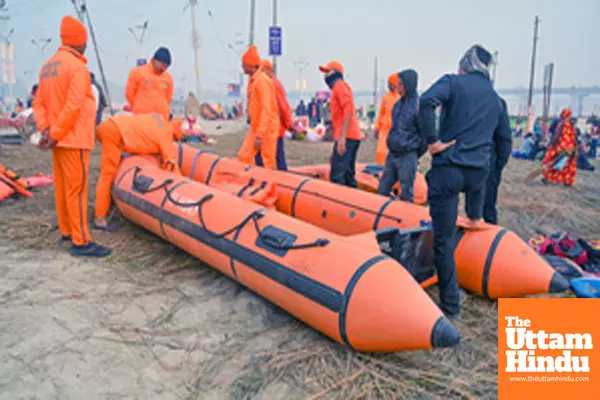 Prayagraj: National Disaster Response Force (NDRF) personnel prepare safety measures along the banks of the Sangam