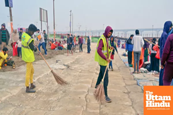 Prayagraj: Workers sweep the ground on a cold morning as part of preparations