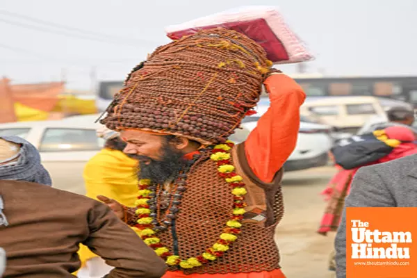 Prayagraj: A sadhu (holy man) with wrapped holy beads over his head at his camp