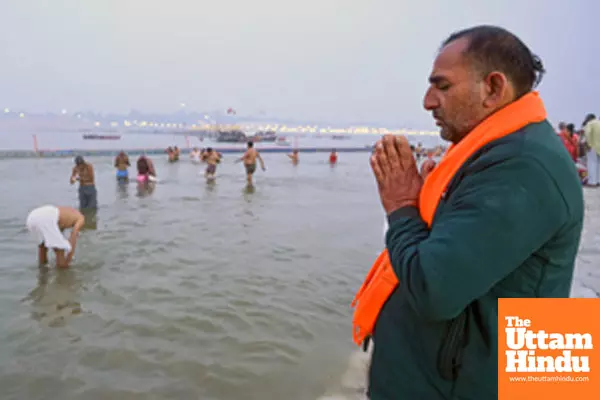 Prayagraj: A devotee offers prayer at the banks of the Sangam