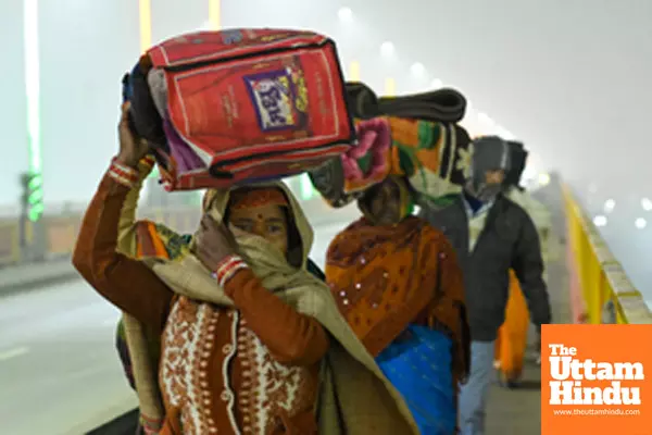 Prayagraj: Devotees arrive to take a holy bath at the banks of the Sangam on the occasion of Paush Purnima