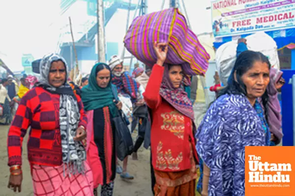 South 24 Parganas: Devotees arrive at Gangasagar Island on a foggy winter morning