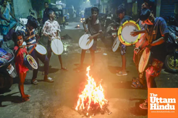 Chennai: Children play drum around the bonfire during the Bhogi celebrations