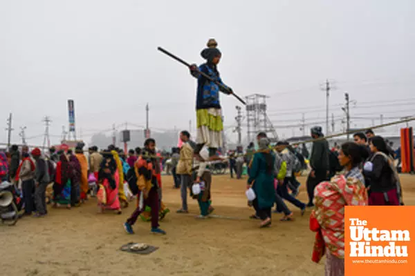 Prayagraj: A young girl performs a tightrope act at the banks of Sangam,