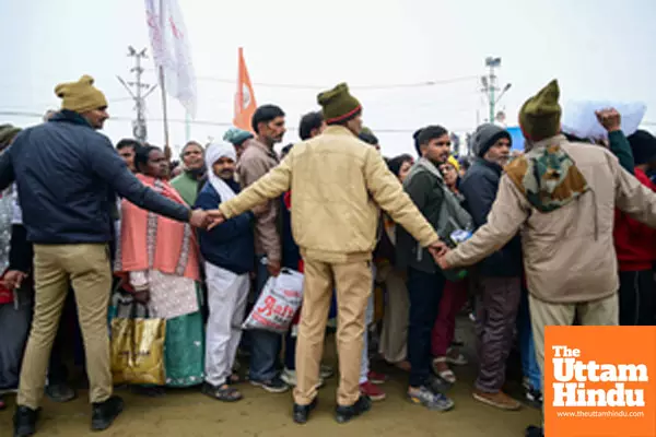 Prayagraj: Police personnel control the crowd at the Triveni Sangam