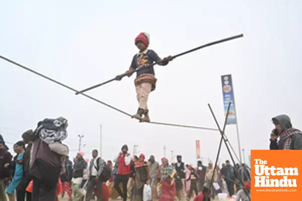 Prayagraj: A young girl performs a tightrope act at the banks of Sangam,