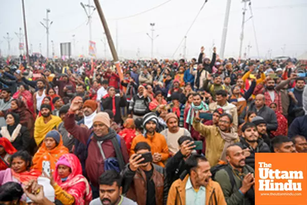 Prayagraj: People gather as Naga Sadhus proceed towards Sangam Ghat for the Amrit Snan (holy bath)