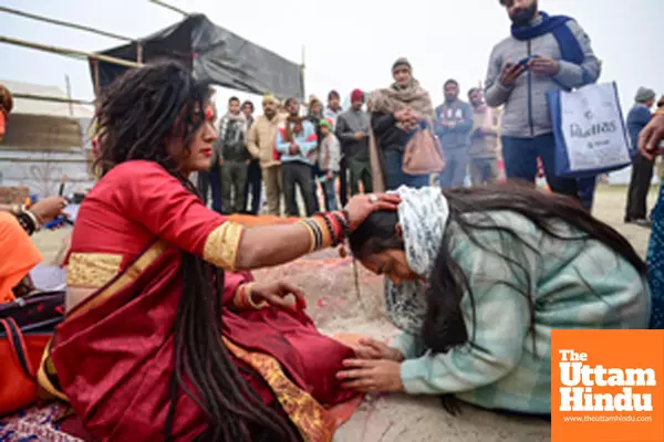 Prayagraj: Devotees seek blessings from a Member of the Kinnar Akhada at the Triveni Sangam