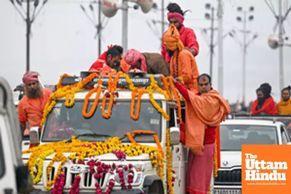 Prayagraj: Sadhus (holy men) arrive to take a holy dip at the Triveni Sangam