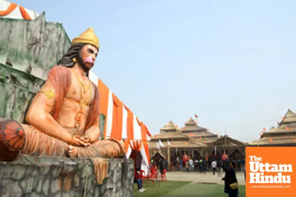 Prayagraj: A statue of Lord Hanuman displayed near decorated pavilions at the Maha Kumbh Mela 2025