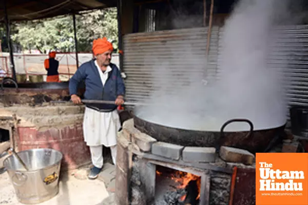 Prayagraj: A worker prepares food for devotees at Sangam during the Maha Kumbh Mela 2025