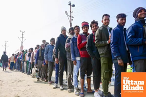 Prayagraj: Devotes in a queue to take Bhojan Prasad (food) at the Triveni Sangam