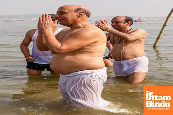 Prayagraj: Defence Minister Rajnath Singh and BJP Rajya Sabha MP Sudhanshu Trivedi take a holy dip at the Triveni Sangam