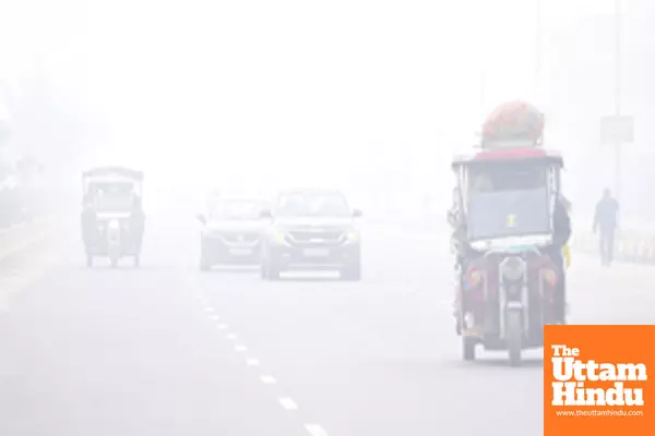 Jaipur: Vehicles move through dense fog on a cold winter evening in Jaipur