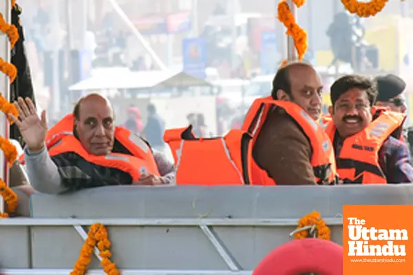 Prayagraj: Defence Minister Rajnath Singh and BJP Rajya Sabha MP Sudhanshu Trivedi take a boat ride at the Triveni Sangam