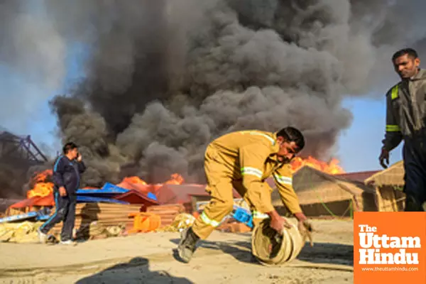 Prayagraj: A firefighter prepares to extinguish a fire that broke out at a camp during the Maha Kumbh Mela 2025