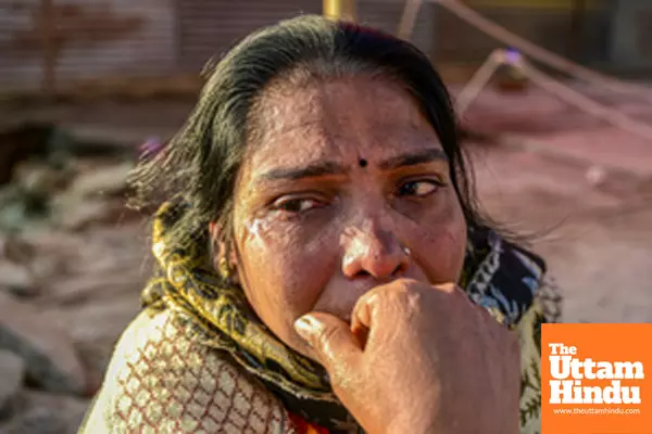 Prayagraj: A woman mourns the loss of her belongings following a fire at a camp during the Maha Kumbh Mela 2025