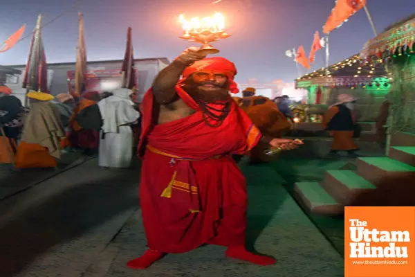 Prayagraj: A sadhu performs aarti at a camp during the Maha Kumbh Mela