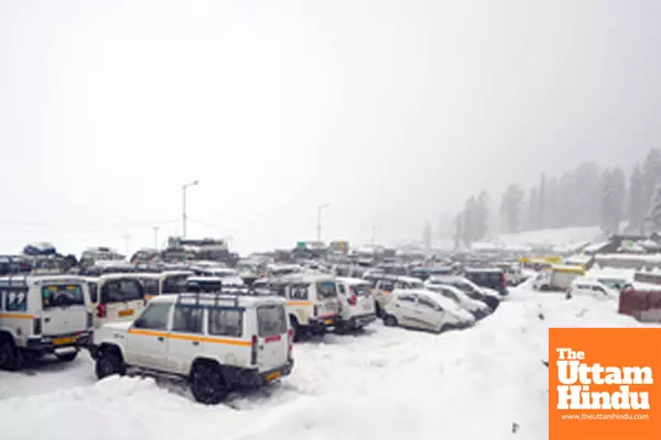 Baramulla: A scenic view of snow-covered taxis