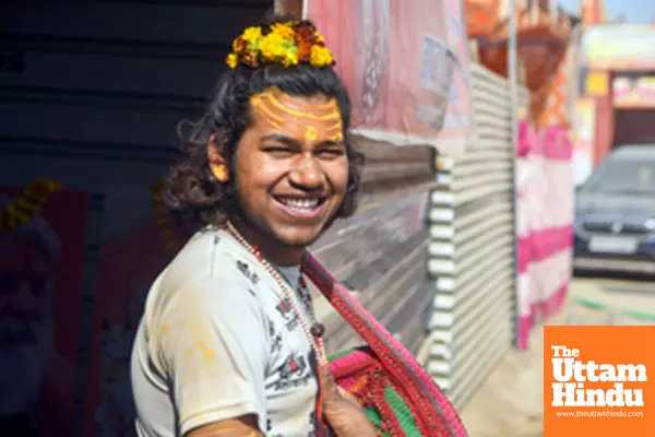 Prayagraj: A devotee poses for a photo at the Triveni Sangam