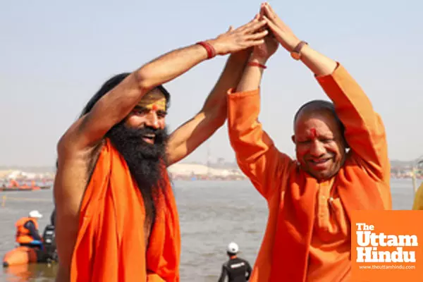 Prayagraj: Uttar Pradesh Chief Minister Yogi Adityanath and yoga guru Ramdev perform yoga poses