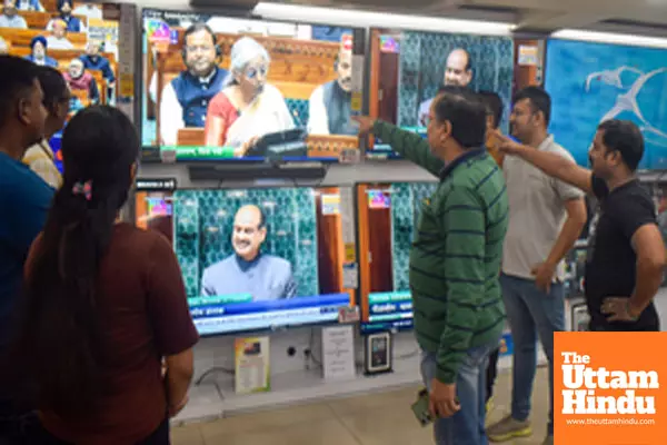 Kolkata: People watch the presentation of the Union Budget 2025