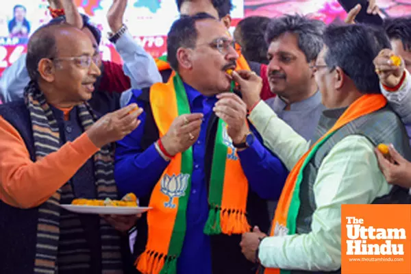 Delhi BJP President Virendra Sachdeva celebrates the partys victory in the State Assembly elections