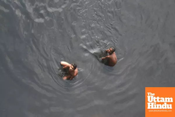 Children take a bath in the Yamuna River