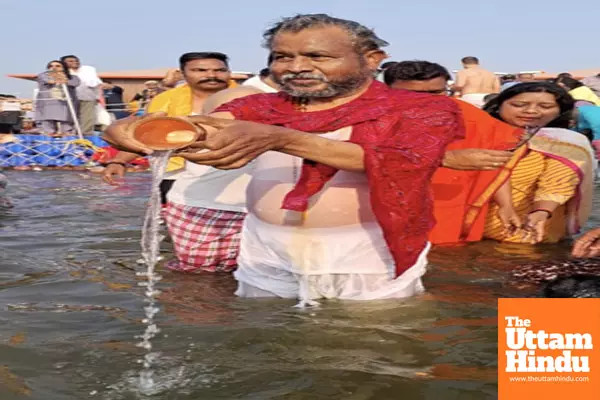 Jharkhand State BJP President Babulal Marandi takes a holy dip at Triveni Sangam