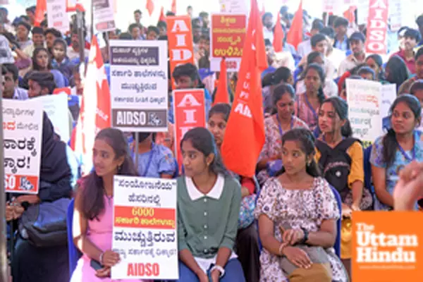 Members of AIDSO protest against the state government