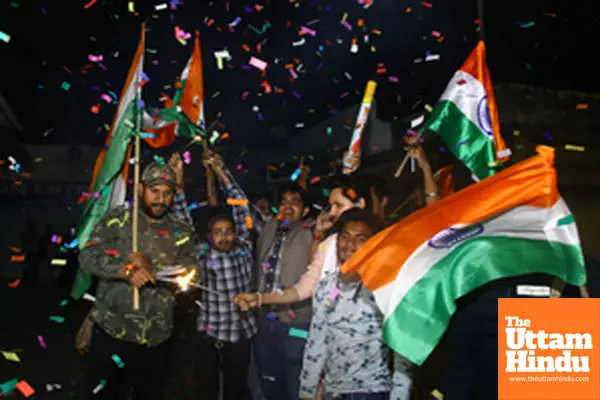 Cricket fans celebrate after India won the ICC Champions Trophy final against New Zealand played at Dubai